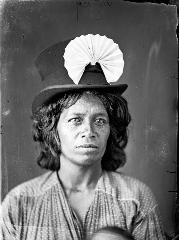 Maori woman, wearing top hat