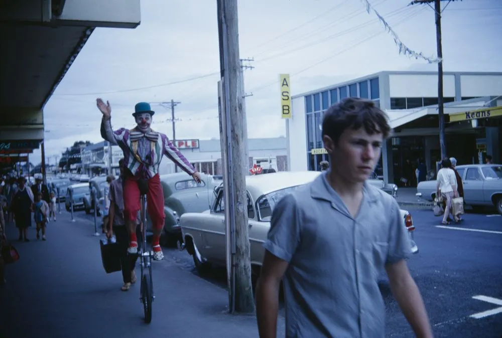 Untitled [Crunchy the Clown on unicycle on footpath]