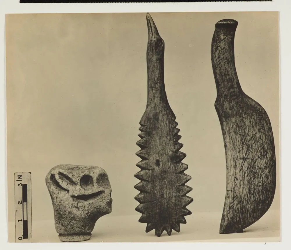 Two Chatham Island/Moriori whale bone patu (short hand weapon) and a small carved stone object