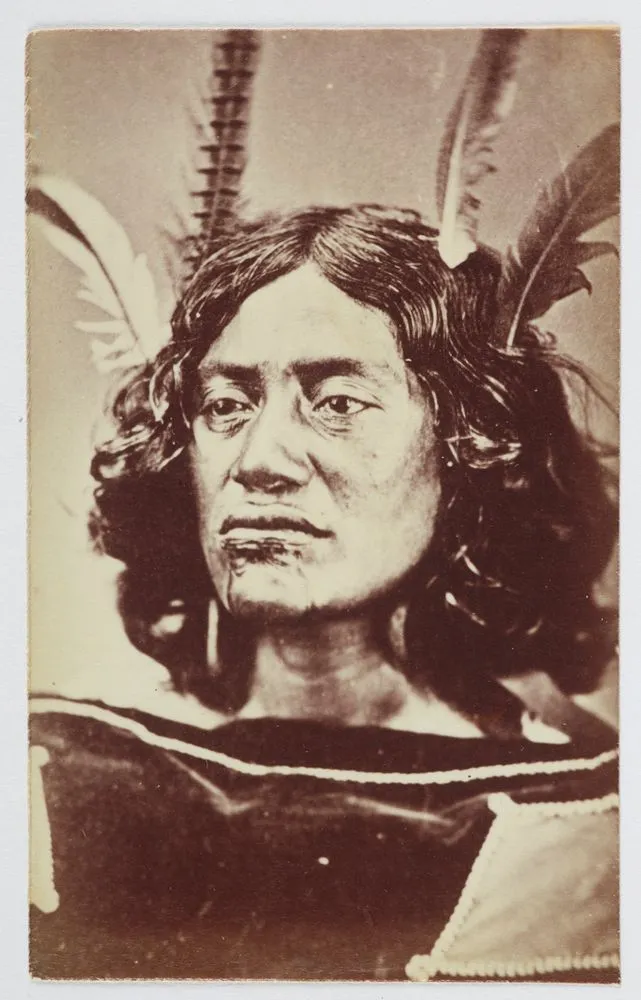 Woman with moko and feathers