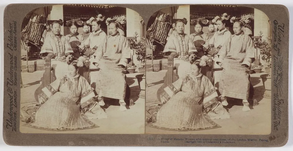 A group of Manchu women with typical head dress, of the London Mission, Peking