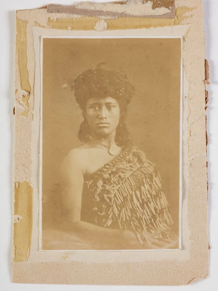 Portrait of a Maori woman wearing headpiece.