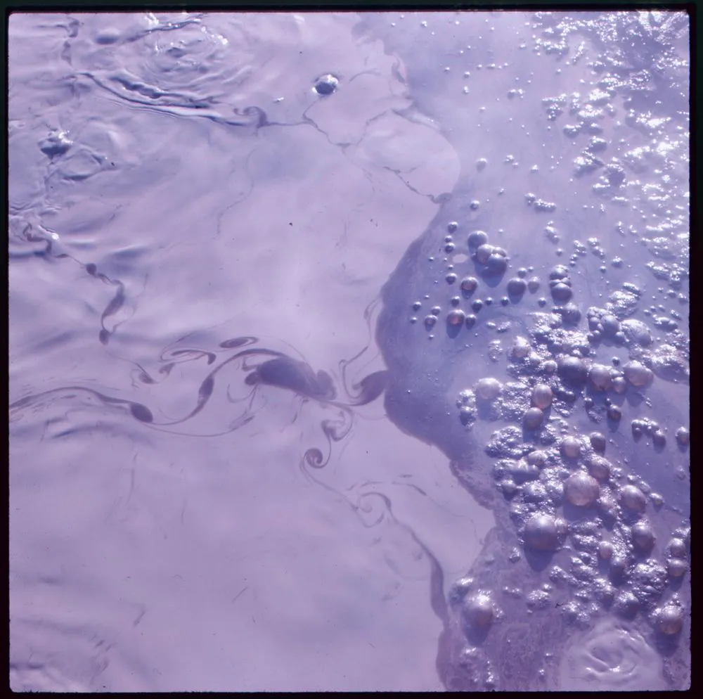 Untitled [Water bubbles in mud pools]