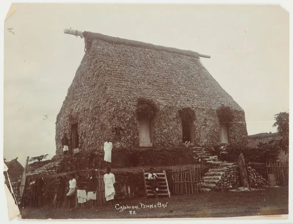 Men outside a bure (hut), Bau Island, Fiji