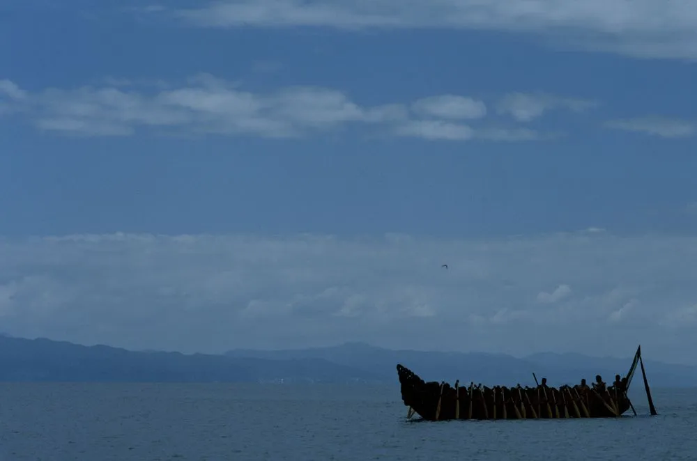 Waka taua (war canoe) in harbour