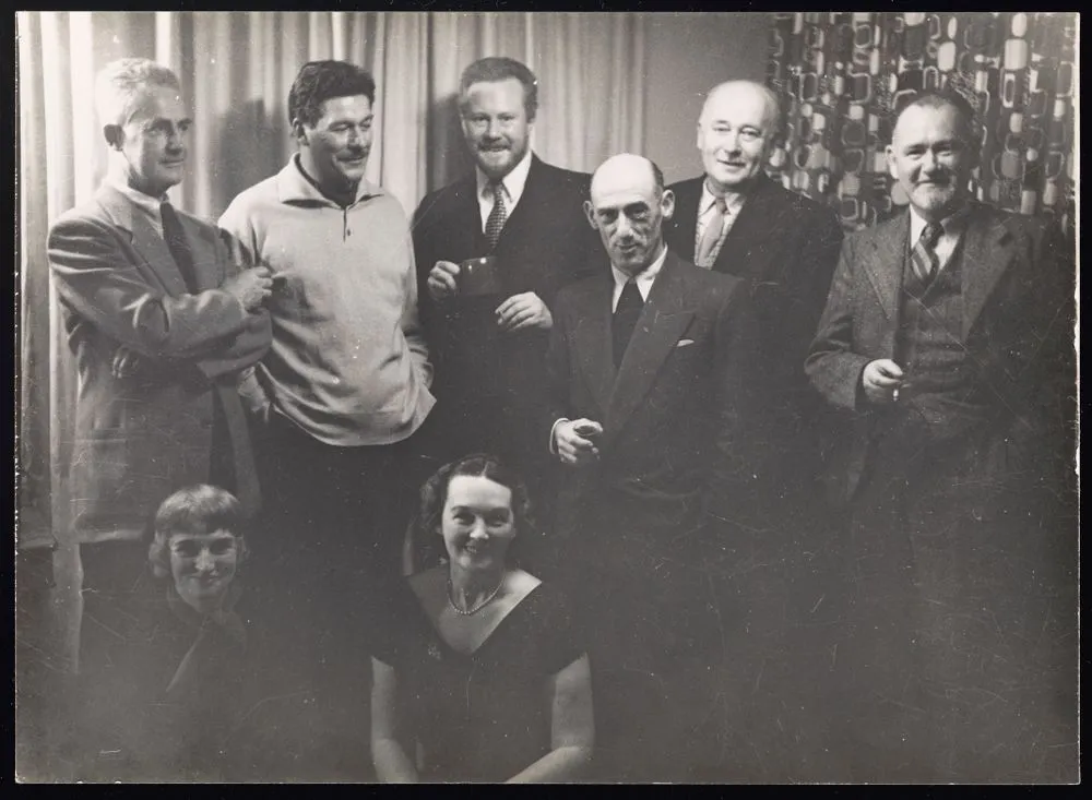 Group photo: Standing, from left to right; George Woods, Peter McIntyre, Leonard Victor Mitchell, E Mervyn Taylor, Eric Ramsden & Samuel Cairncross. Seated; Avis Higgs and Florence Luxford