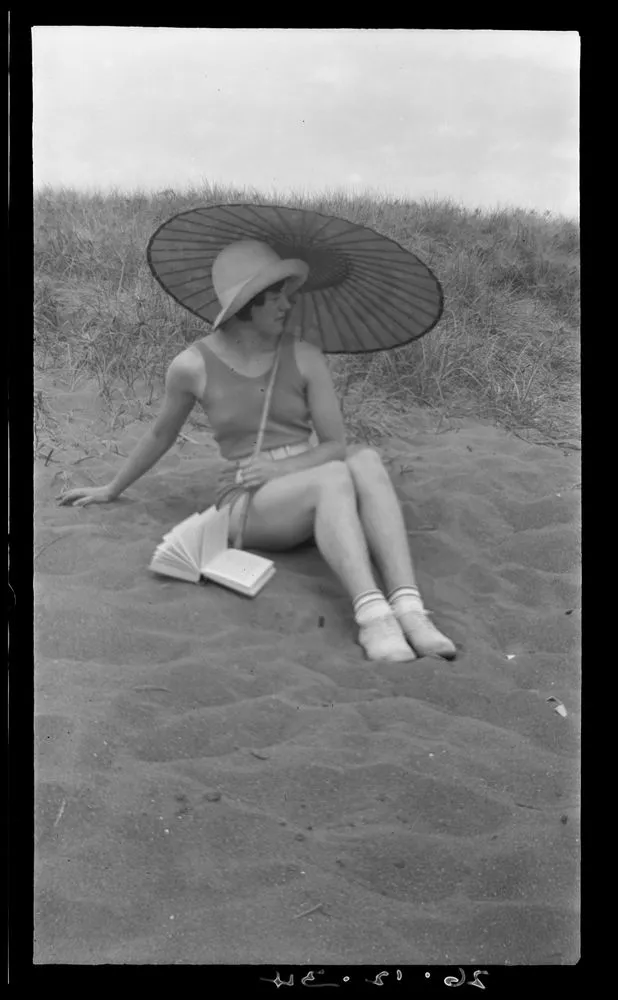 Woman at beach with parasol