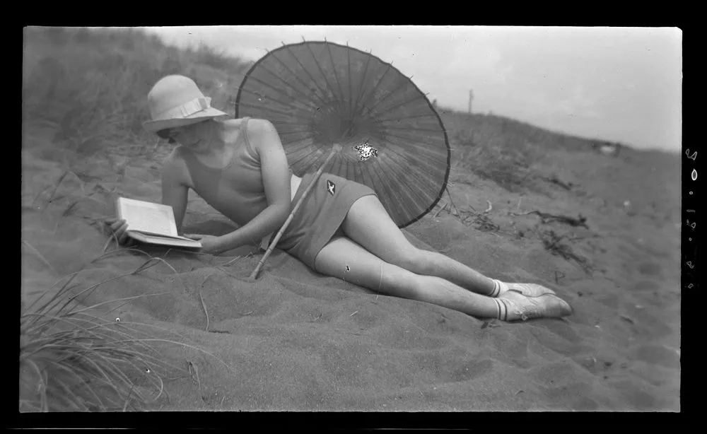 Woman reading at beach