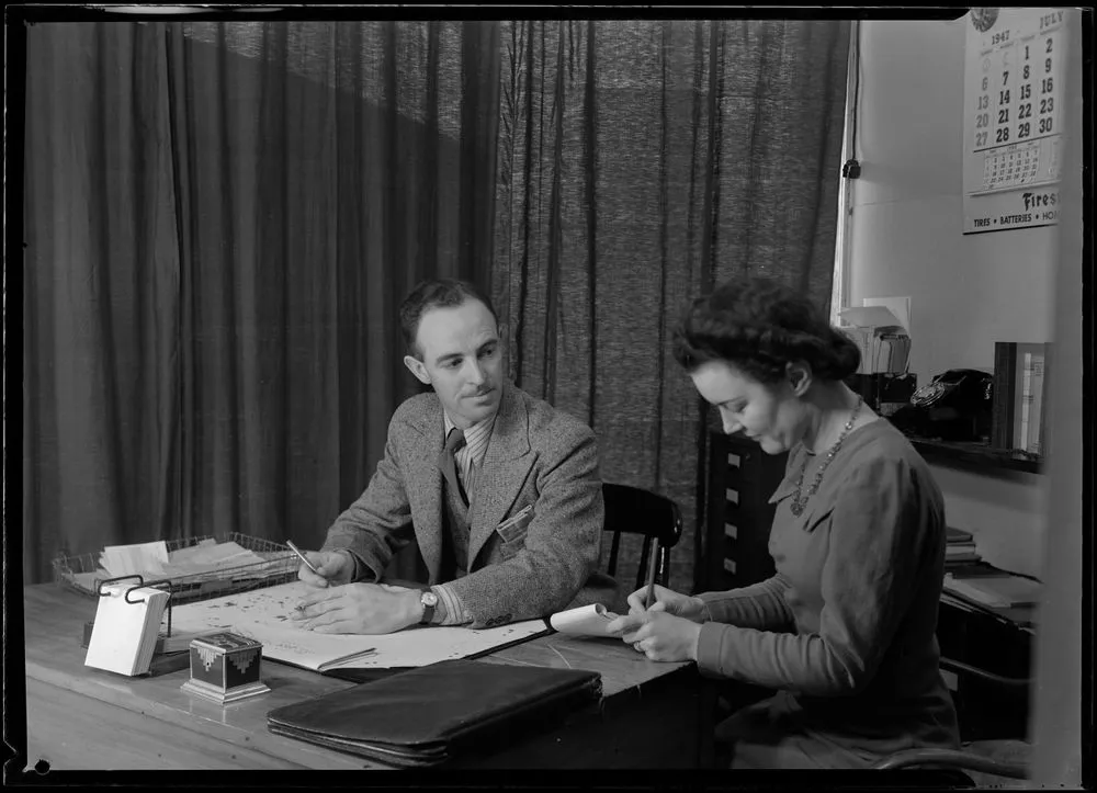 Man and Woman at Desk