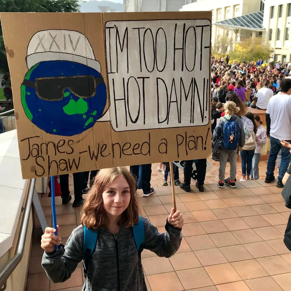 Hazel Cubis with her School Strike for Climate Action placard, Wellington