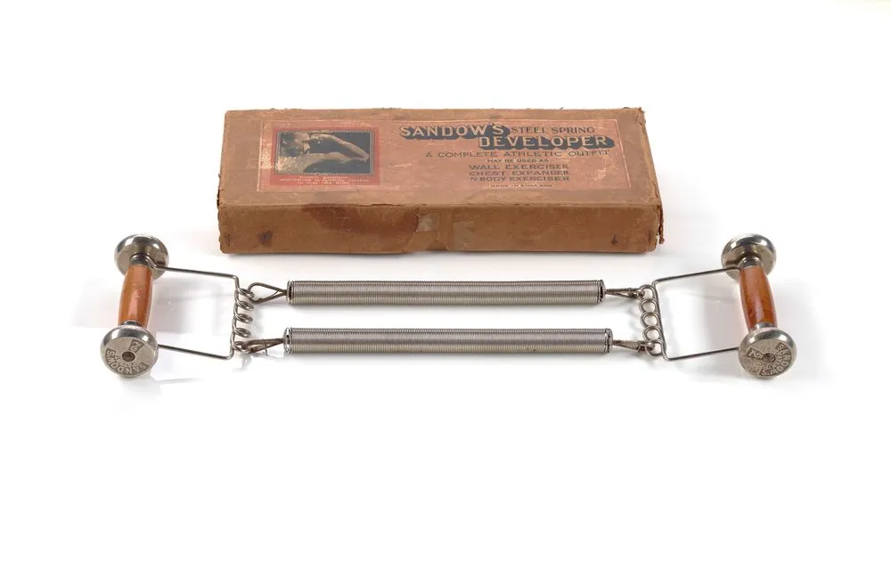 Sandow chest expander in box with accessories