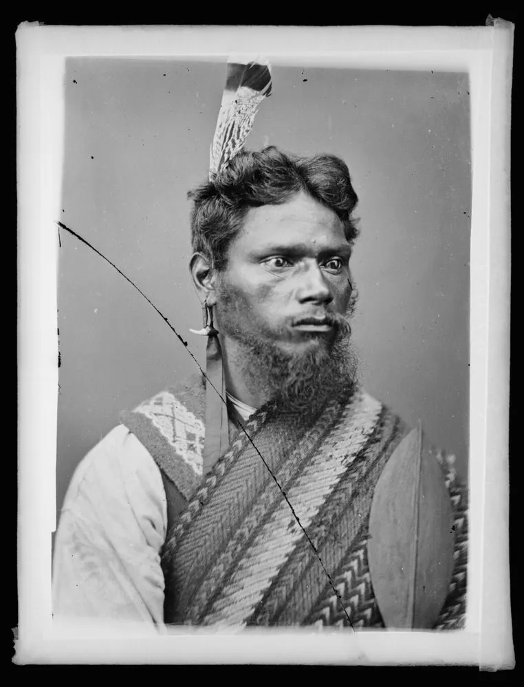 Maori man, bearded, feather in hair