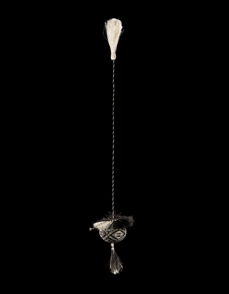 Poi tāniko (kinetic percussion instrument) named "Te Pō-i-roa"