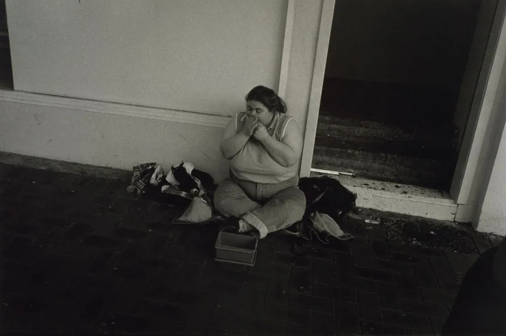 Untitled, no.31 (woman sitting on street playing the harmonica). From the series: Public