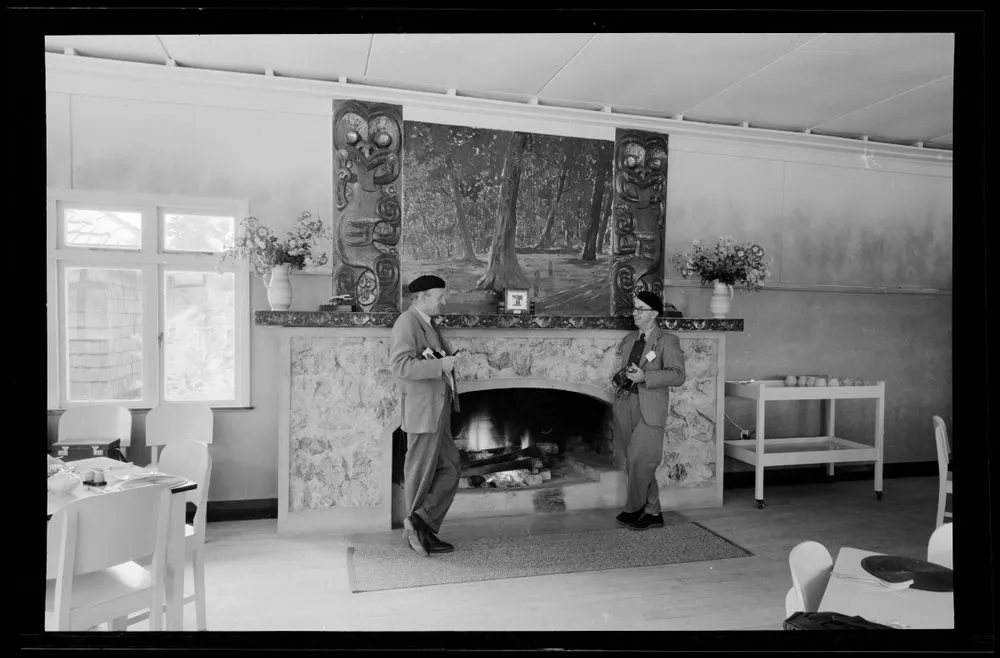 [Two photographers at fireplace]