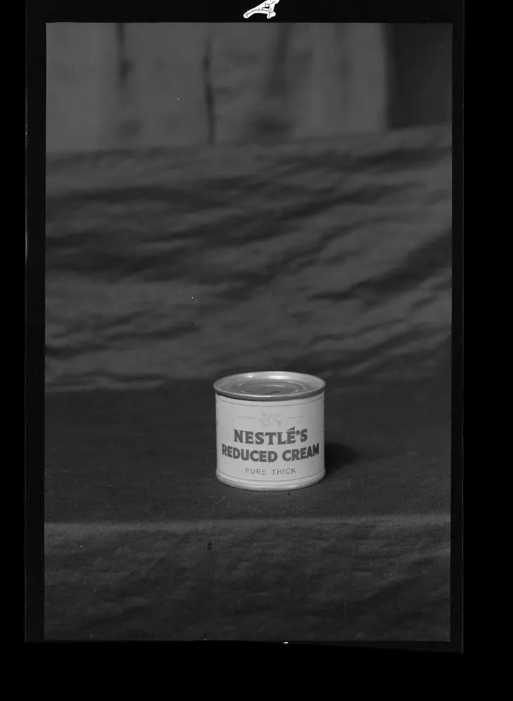 Product shots; inscribed 'Woolworths. Cheese & Nestle Cream'