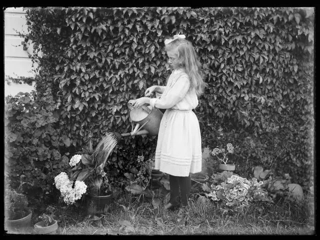 Vivian Adkin watering pot plants