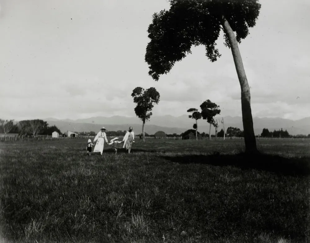 Women and children in field