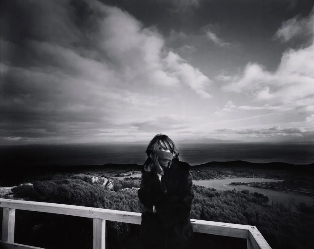 Greta and the view south from Bluff Hill, Stewart Island in the distance: Bluff 1981