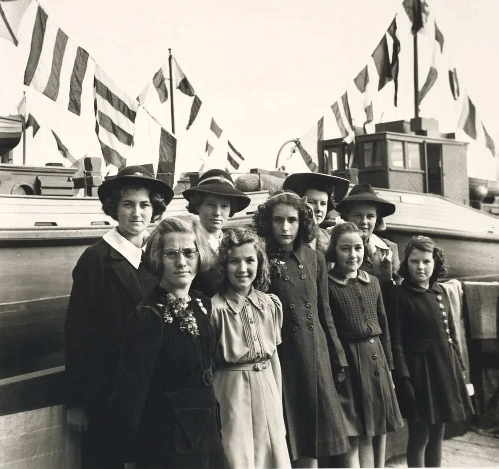 Daughters of shipbuilders at boat launching, Auckland, August 1944.