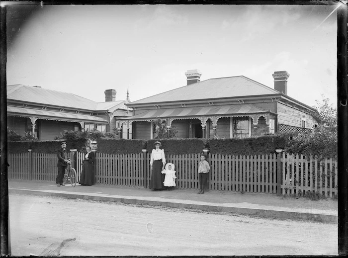 Godber family outside their house, Railway Whare, at 23 Bay Street, Petone