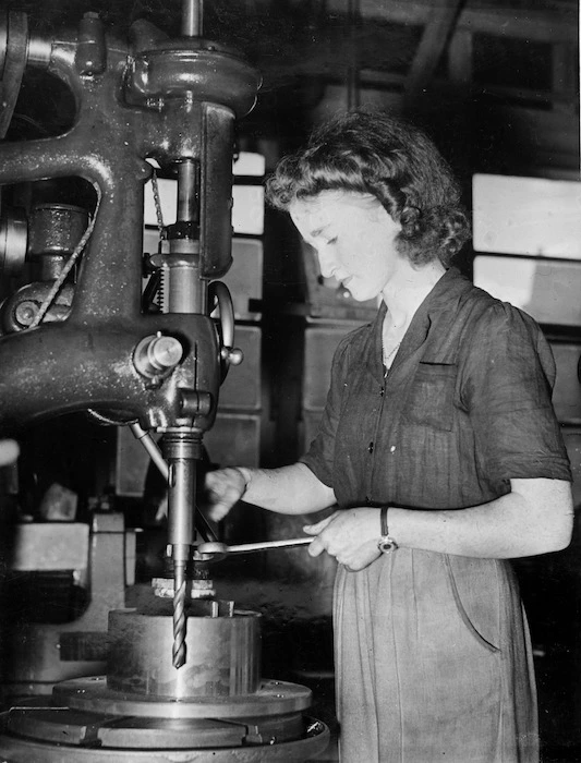 Woman working a drill press
