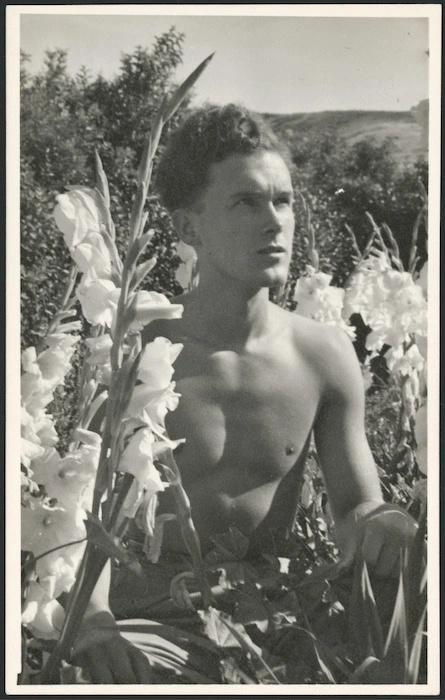 Man photographed among flowers