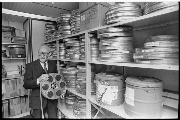 Chief film censor Arthur Everard with reels of film - Photograph taken by Merv Griffiths