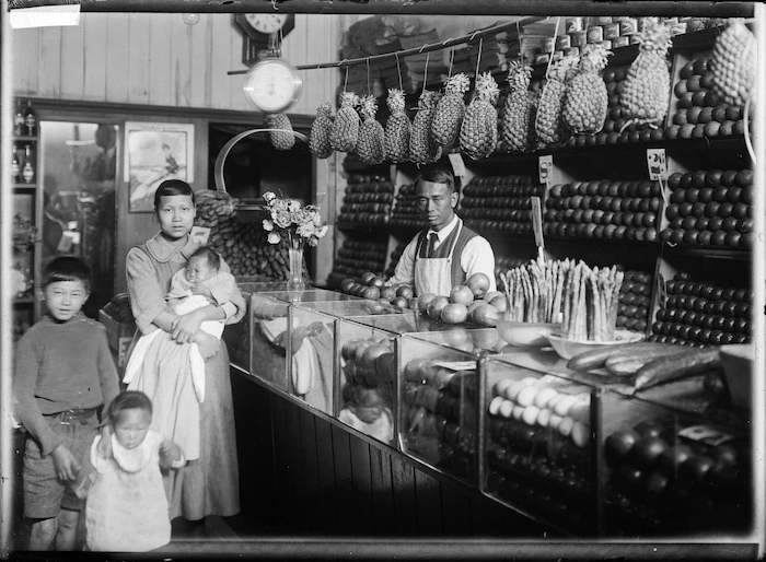 Chinese family in a greengrocer's shop