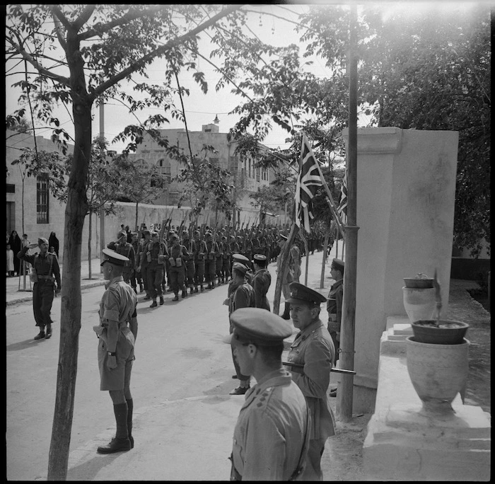 26 NZ Battalion marching past saluting base at Dier el Zor, Syria - Photograph taken by H Paton