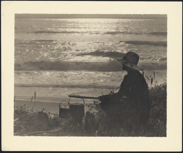 Woman boiling billies by beach