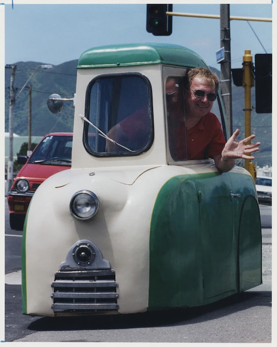 Rod Davenport in a one person electric car, Petone - Photograph taken by Mark Coote