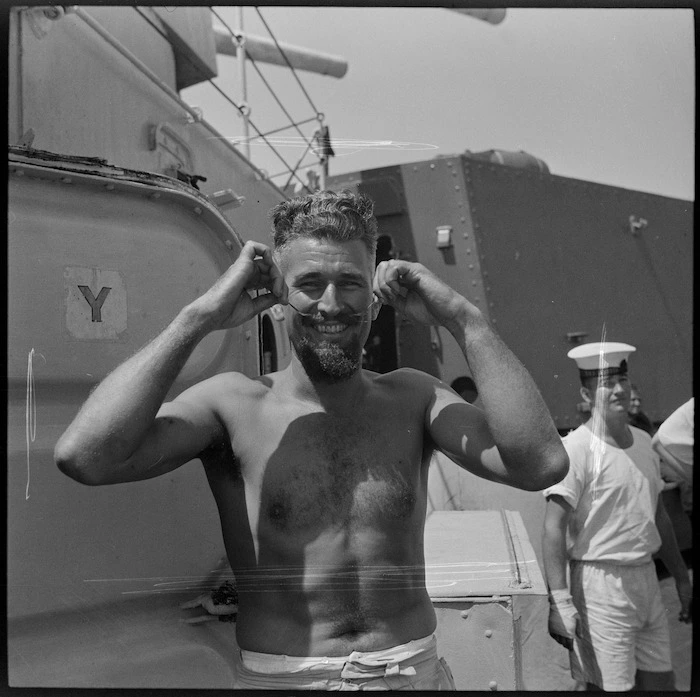 Crew member of HMS Leander with fine moustache