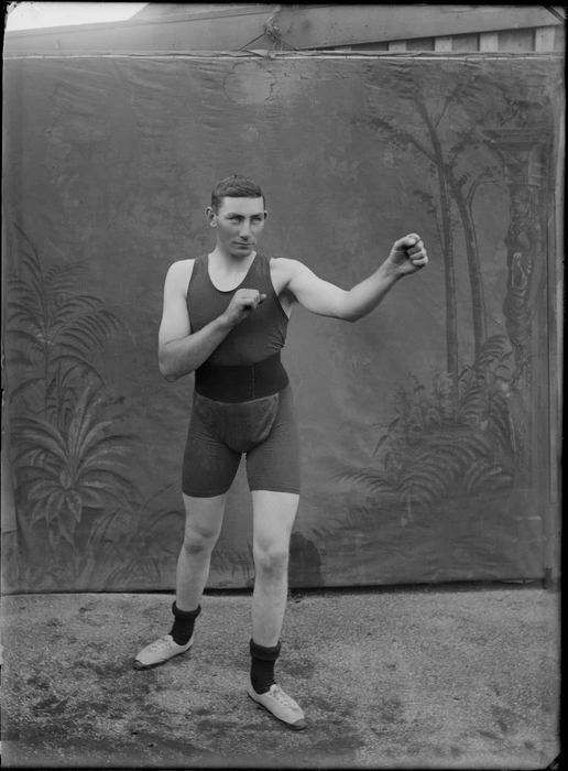 Studio portrait of an unidentified man in a boxing pose