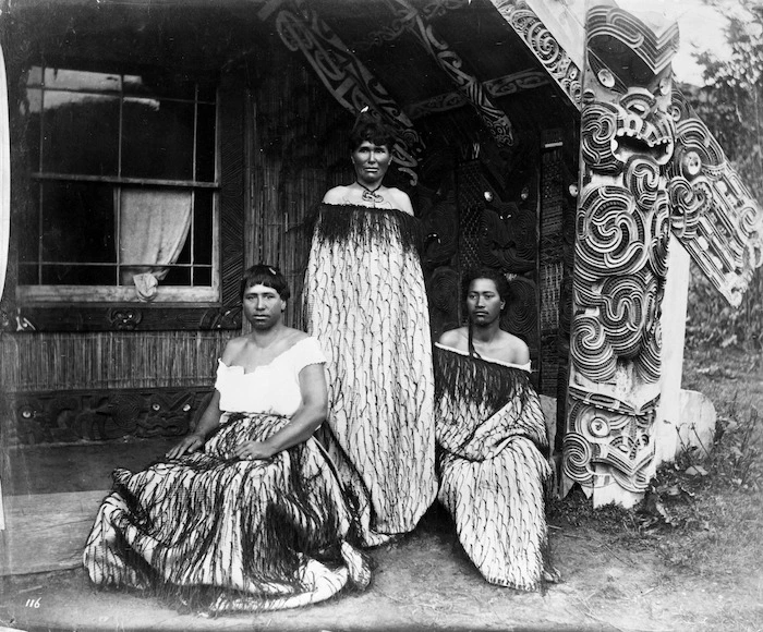 Sophia Hinerangi, Kate Middlemass (Kati), and another guide, outside Hinemihi meeting house, Te Wairoa