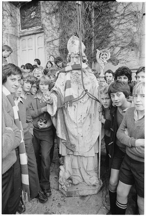 Students from St Patrick's College, Wellington, by the College's statue of St Patrick after its removal for relocation - Photograph taken by Merv Griffiths