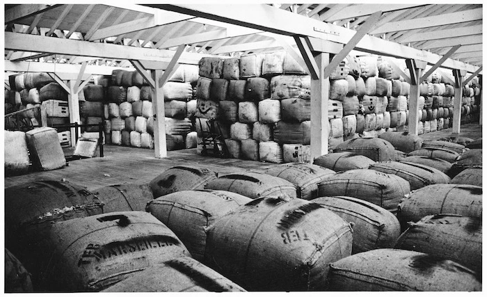 Bales of wool stacked in a wool store