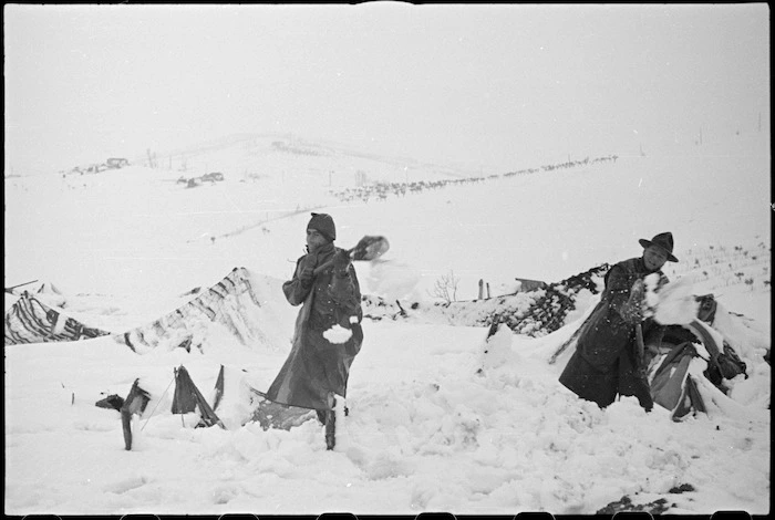 New Zealanders on the Italian Front clear their bivvies of snow on the Italian Front, World War II - Photograph taken by George Kaye