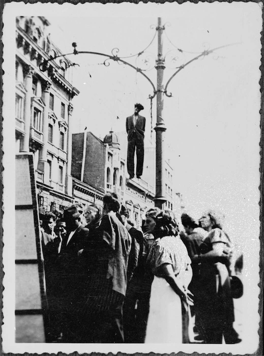 Captured German film showing body of man hanged from lamp post, possibly in Belgrade, World War II