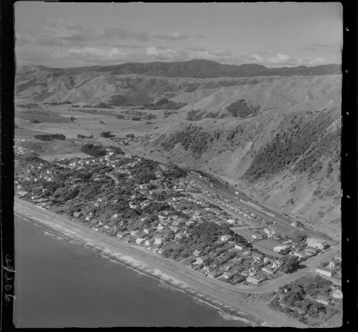 Paekakariki Beach coastal settlement with railway station and yards, Beach Road and The Parade road looking north, Kapiti Coast, Wellington Region