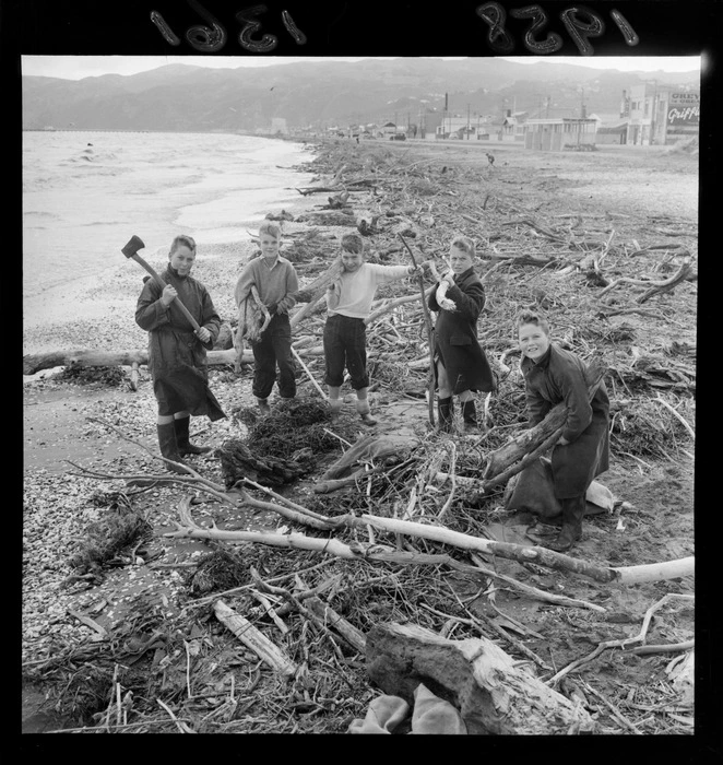 Five unidentified boys collecting driftwood on Petone Beach