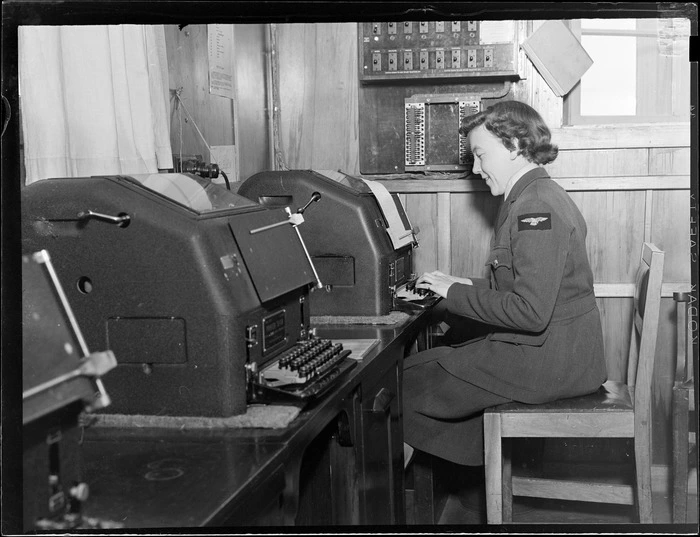 View of unidentified WAAF using a teleprinter, Meteorological Section, Mechanics Bay, Auckland City