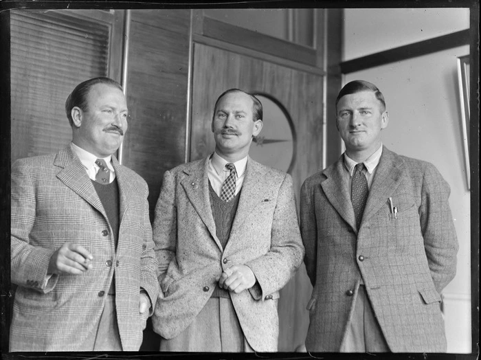 Glover family portrait, Whites Aviation office, Dilworth building, Auckland, (L to R) Captain H L M Glover BOAC (British Overseas Airways Corporation), B G Glover, ex 25, 78, 102 squadrons and Denis Glover, ex Navy Christchurch