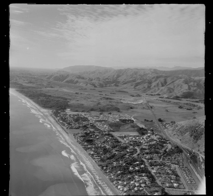 View north over the Kapiti coastal settlement of Paekakariki with Wellington Road and Paekakariki School, railway yards and State Highway 1, Wellington Region