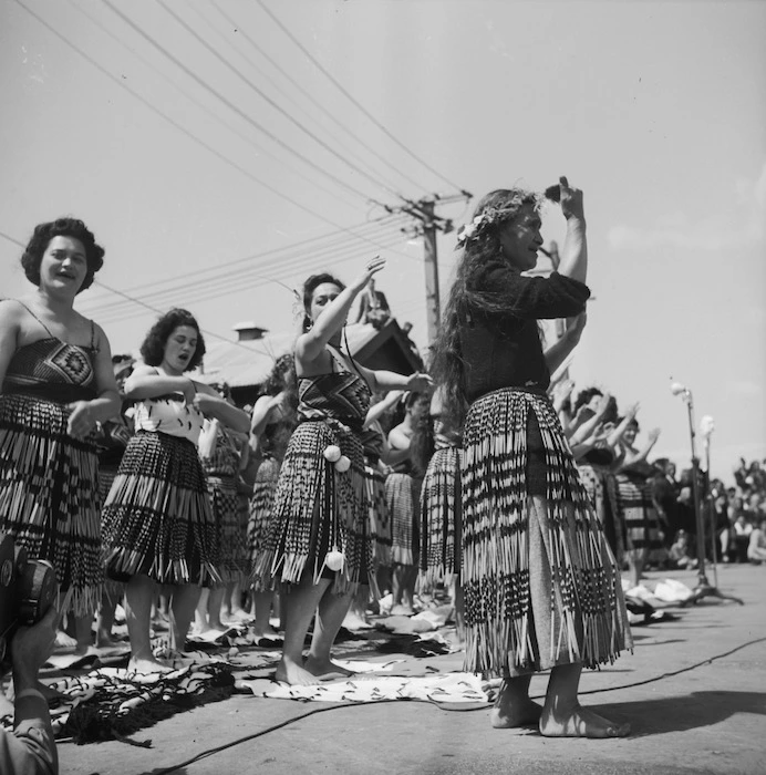 Women performing waiata to welcome home the Maori Battalion after World War II