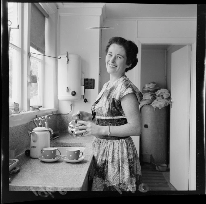 Mrs N? Mackie in the kitchen making a pot of tea, wife of Jockey Mr C Mackie