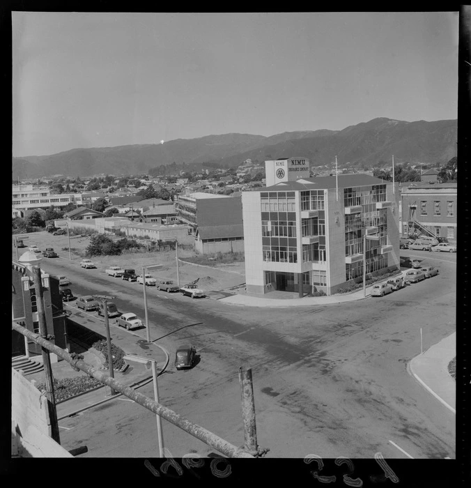 Queens Drive with Laings Road in foreground and NIMU Insurance Company building on corner, Lower Hutt