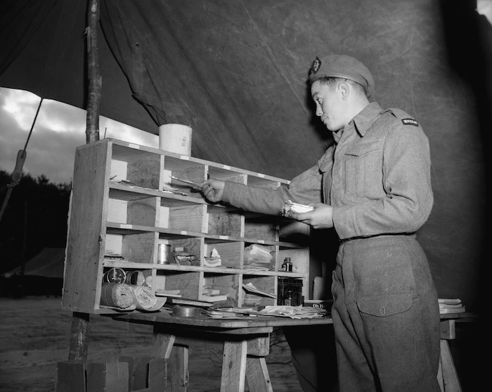 Postman Harry Polson sorting mail for personnel of 10 Company, RNZASC, Korea