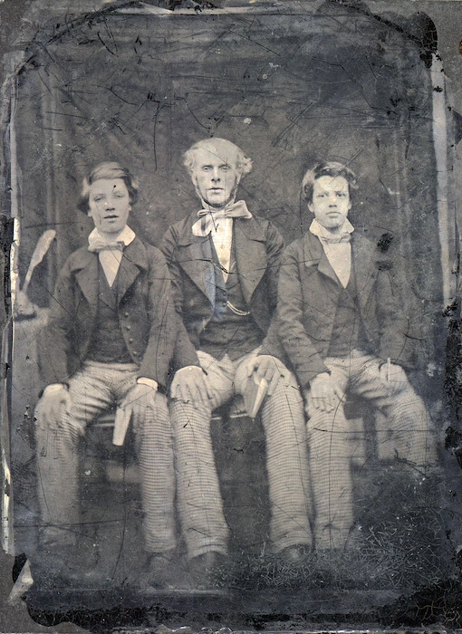 Unidentified man and two boys