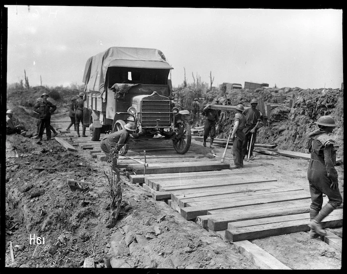 Members of the Pioneer Battalion laying a road in Messines, Belgium